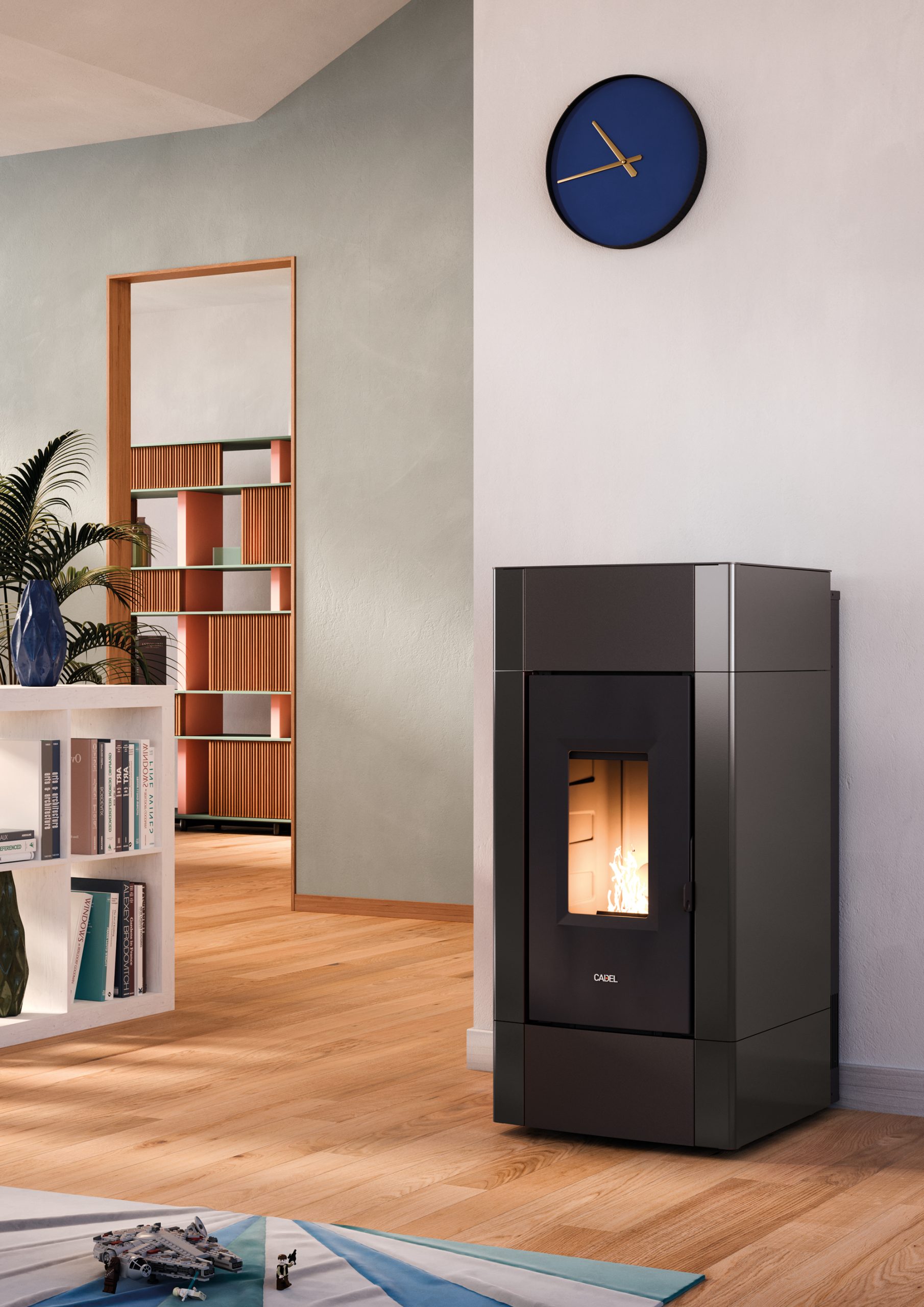 Pelletskamin CADEL Cristal 9 kW placerad i modernt vardagsrum med traegolv och stilren inredning.